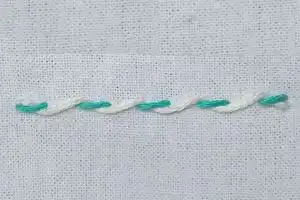 Punto hilván enrollado